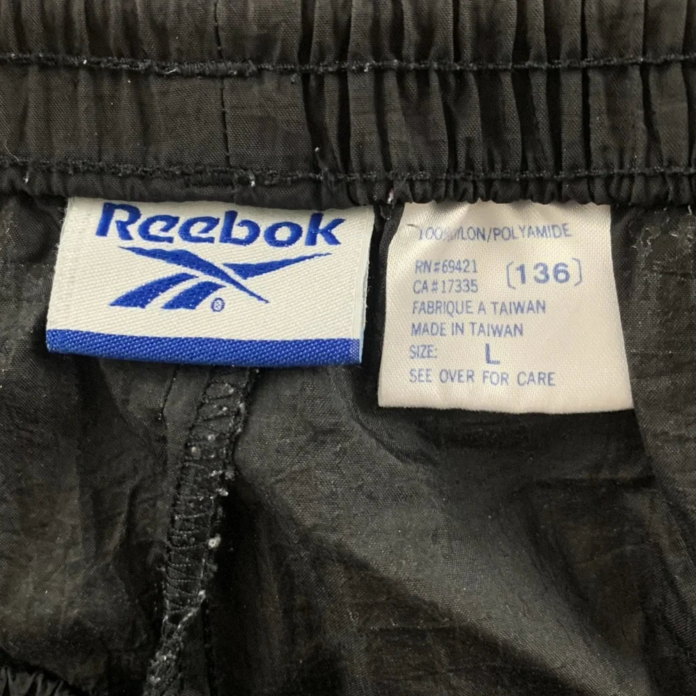 Vintage 90s Reebok Nylon Embroidered Logo Zip Leg Track Pants Joggers Sw…